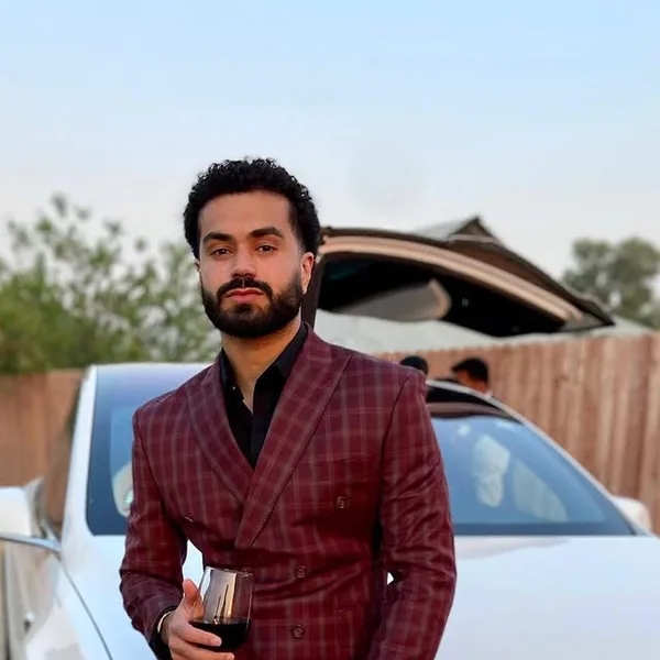 A burgundy check double-breasted suit