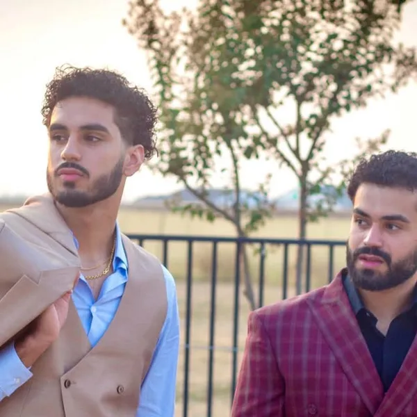 A tan three-piece and a burgundy check double-breasted suit